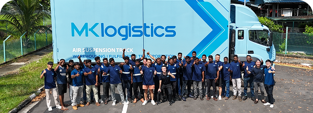 MK Logistics operations team in front of a truck